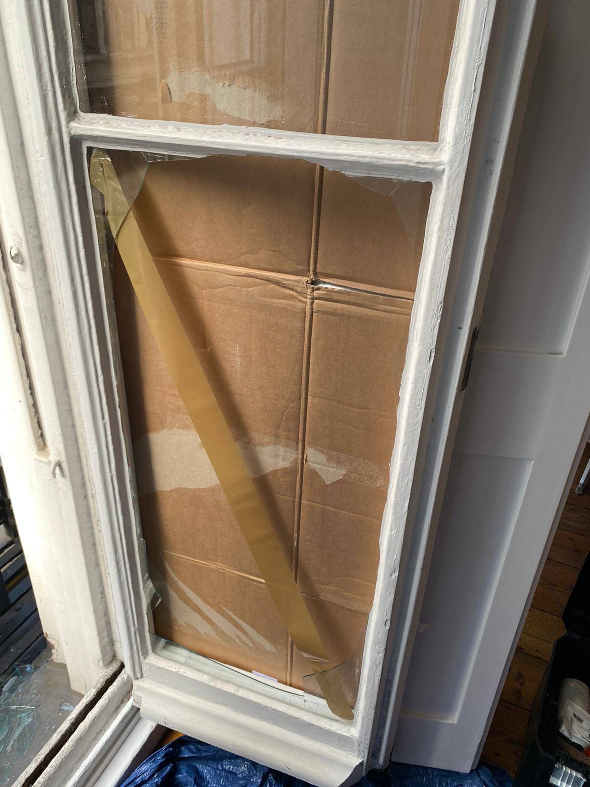 process of changing the glass in a wooden door