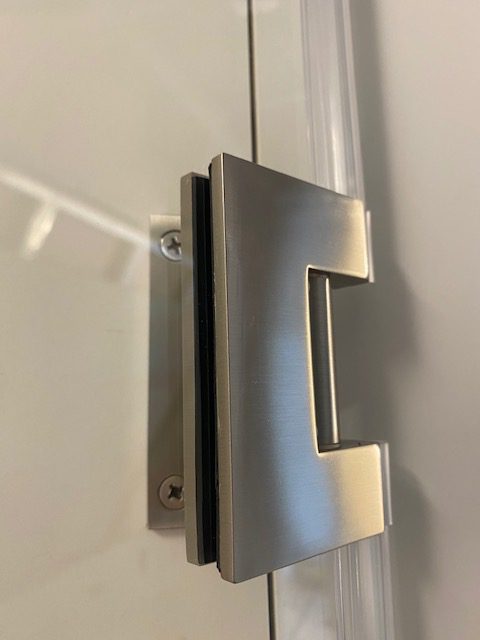 metal mechanism in glass doors installed by local glaziers London